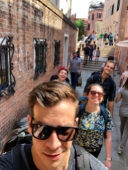 The backpack club working through the streets of Venice.